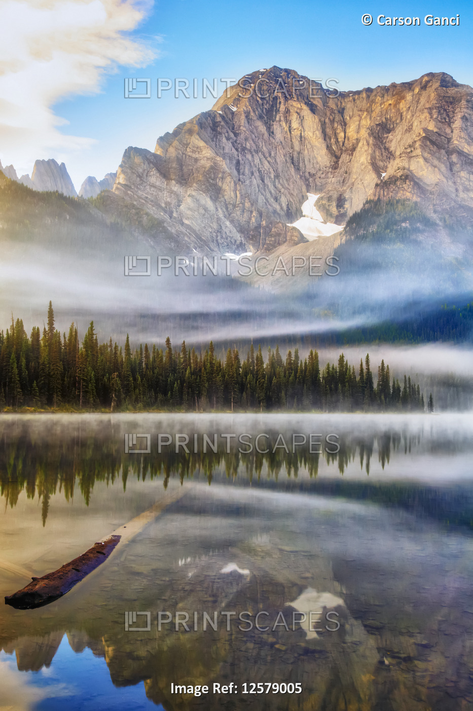 Tranquil lake with reflections in Elk Lakes Provincial Park; British Columbia, ...