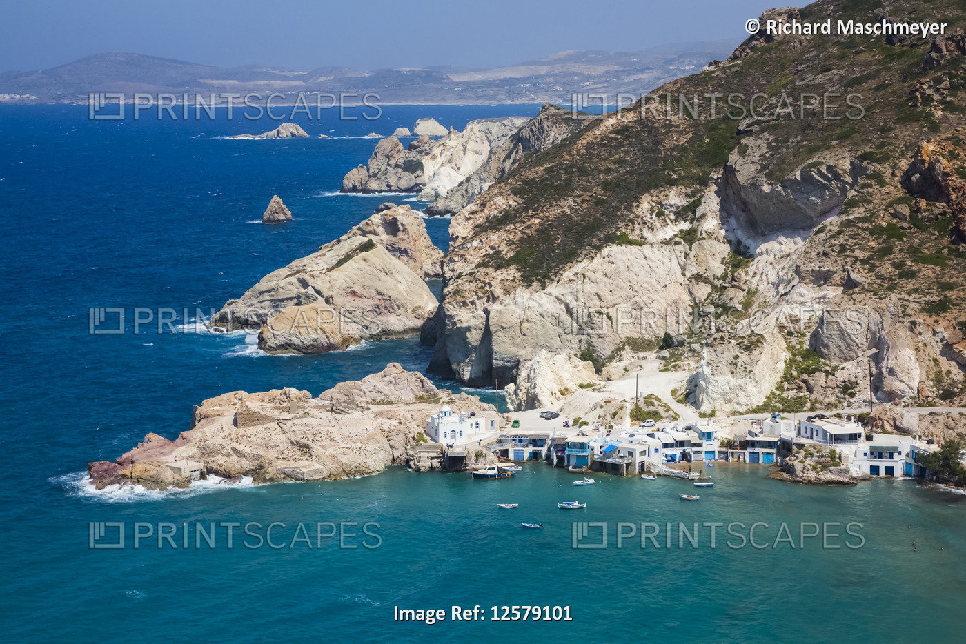Fyropotamos Village with boats in the small harbour and a view of the rugged ...