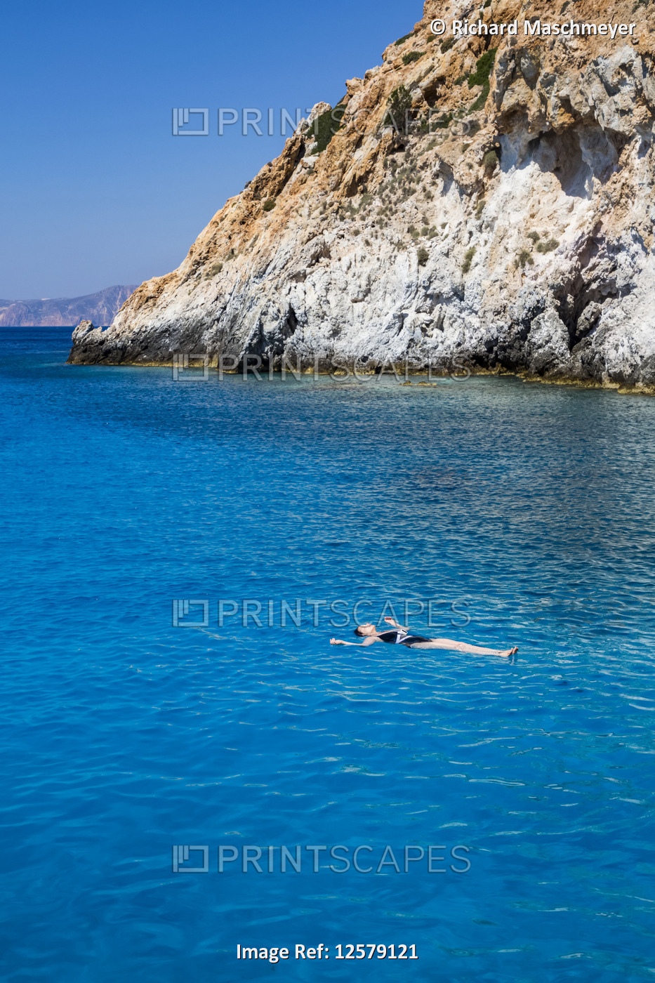 Tourist floating, Galazia Nera Bay; Polyaigos Island, Cyclades, Greece