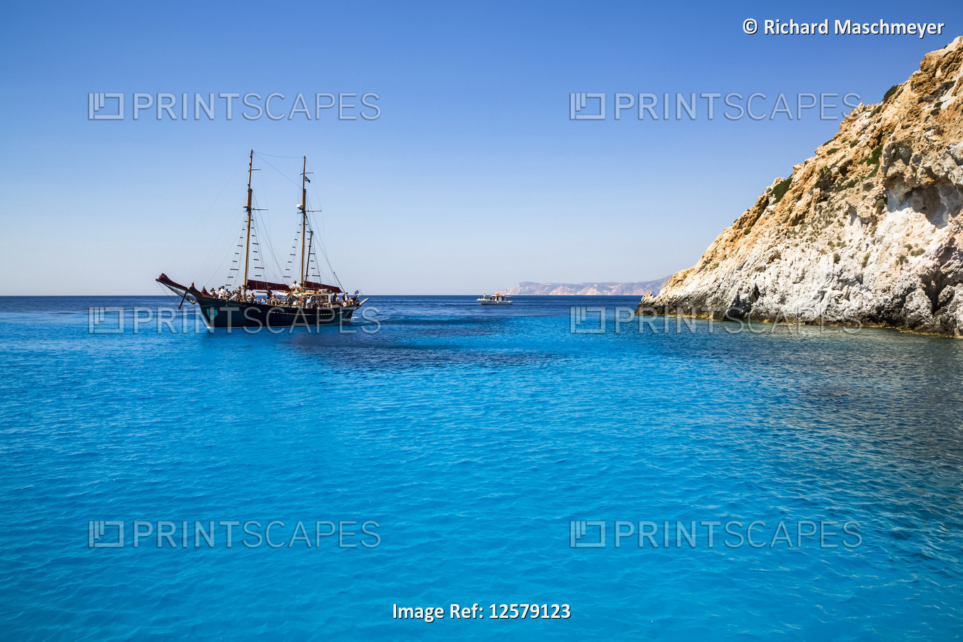 Tourists with tour boat in Kleftiko Bay; Milos Island, Cyclades, Greece
