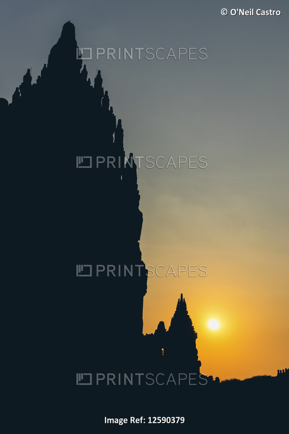 Sunset at Prambanan Temple with silhouetted peaks; Yogyakarta, Indonesia