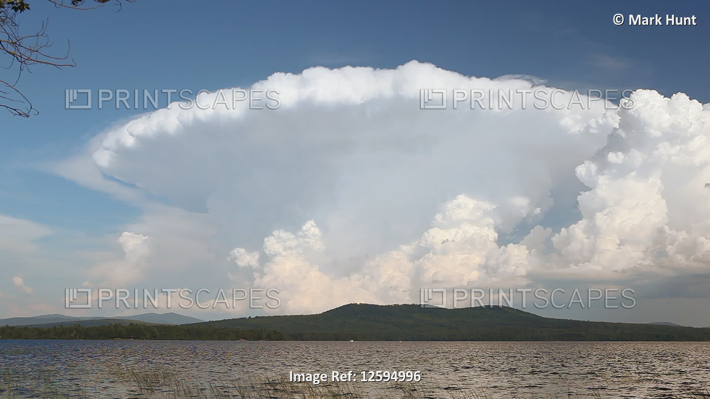 Cumulonimbus clouds over a lake, Lake Umbagog, New Hampshire, USA; New ...