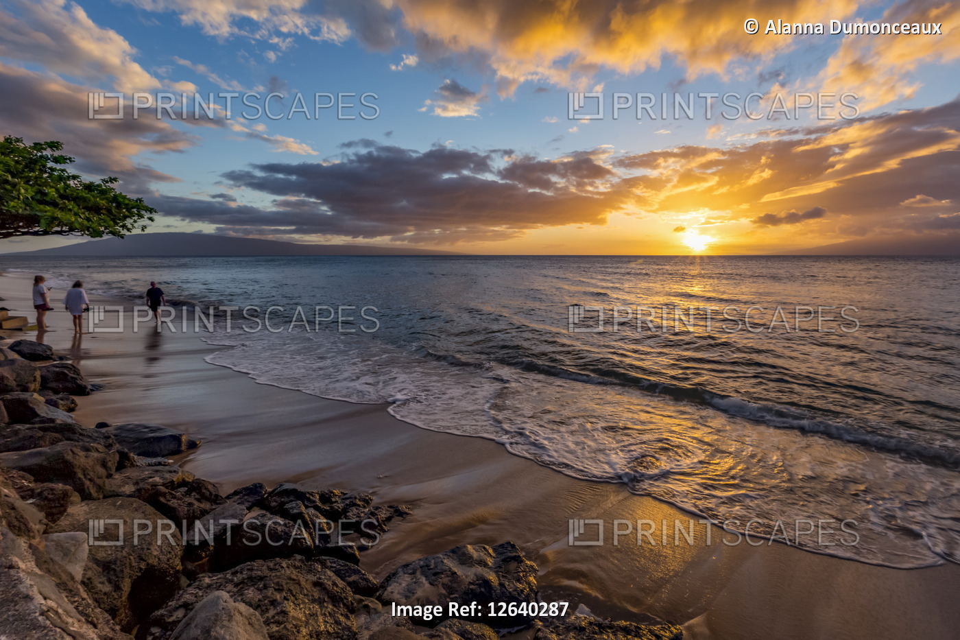 A calm sunset beach view from a vacation resort; Kaanapali, Maui, Hawaii, ...