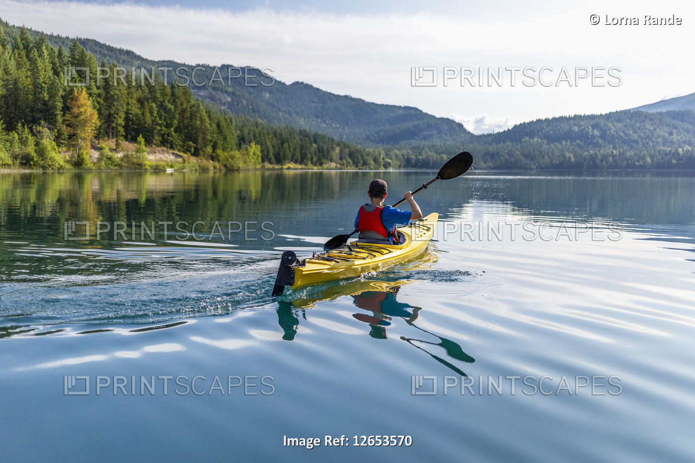 A teenage boy kayaking on White Lake, White Lake Provincial Park; British ...