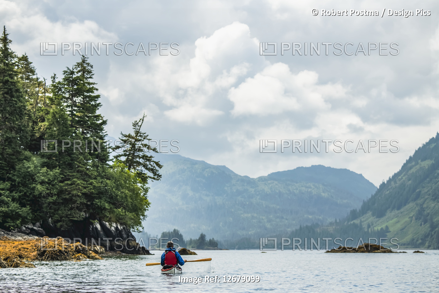 Kayaker paddling in Prince William Sound; Alaska, United States of America