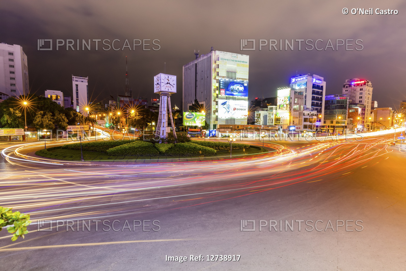 Light trails and glowing lights, Dien Bien Phu roundabout; Ho Chi Minh City, ...