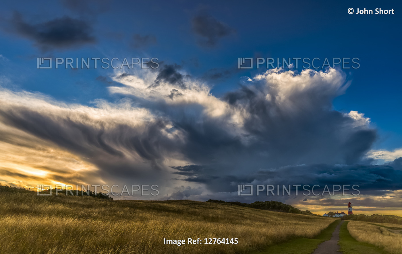 Dramatic cloud formation over Souter Lighthouse at sunset; South Shields, Tyne ...