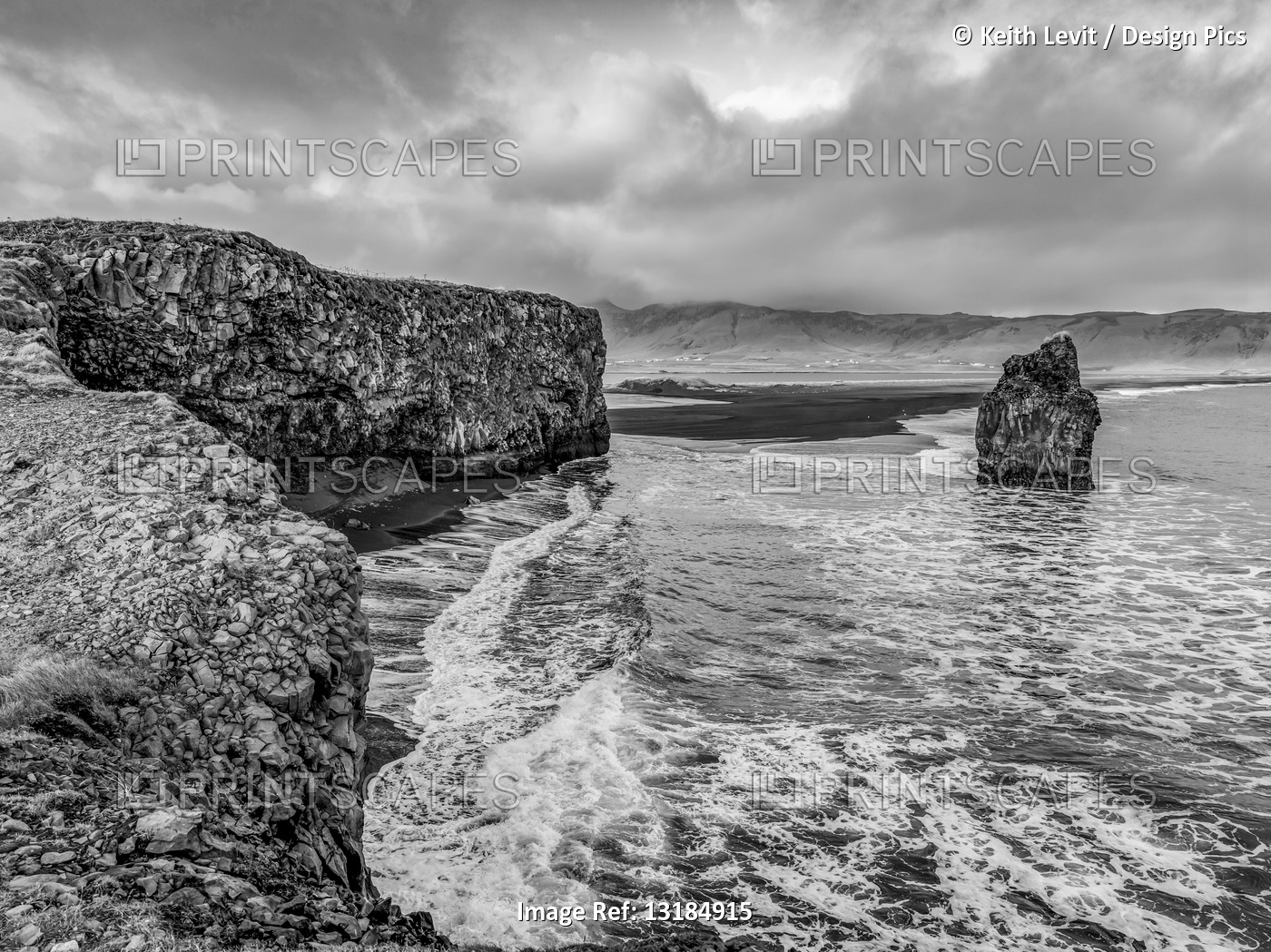 Black and white image of rugged terrain along the coast of Southern Iceland; ...