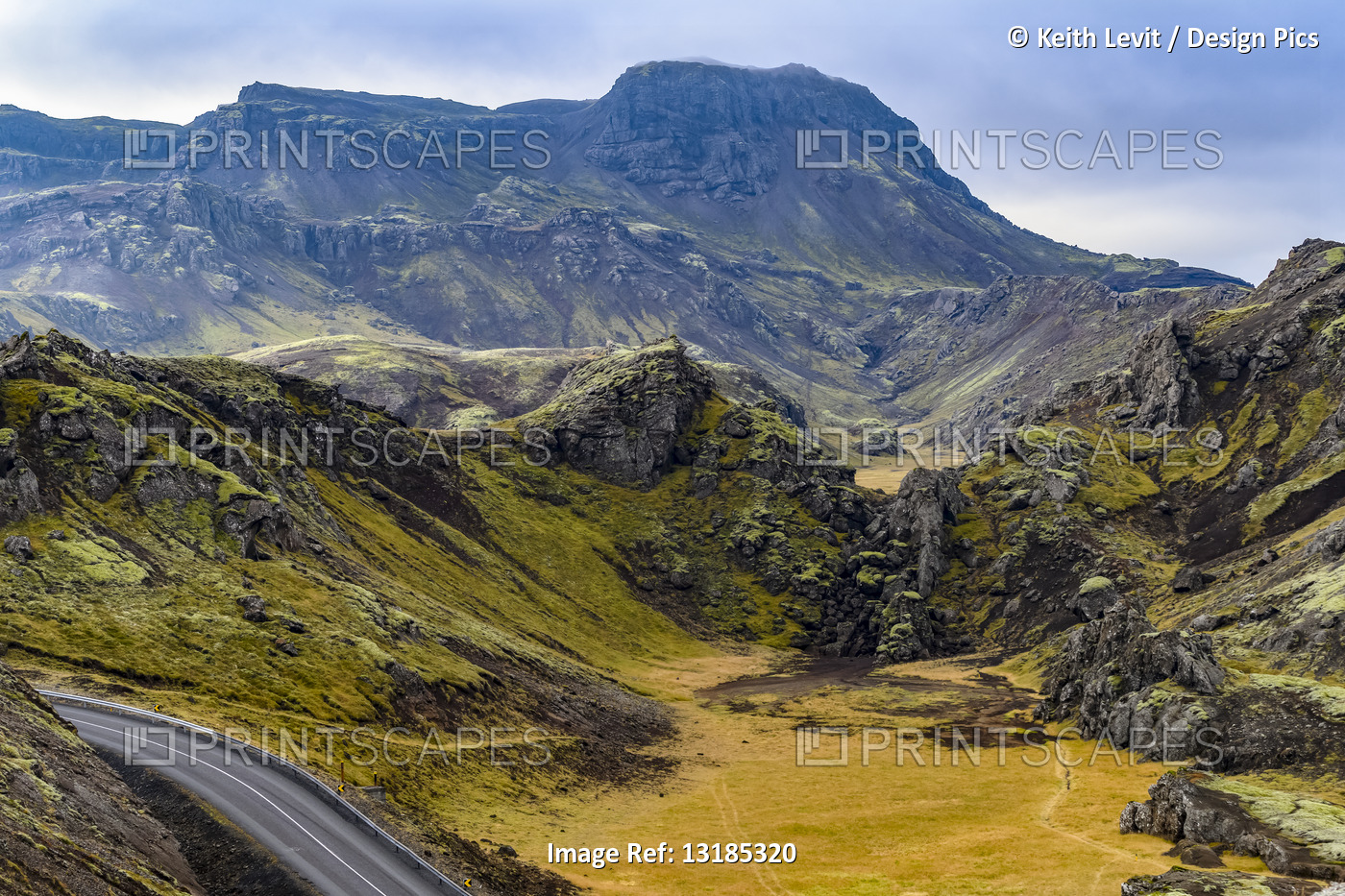 A road winds through a rugged landscape in Southern Iceland; Grimsnes- og ...