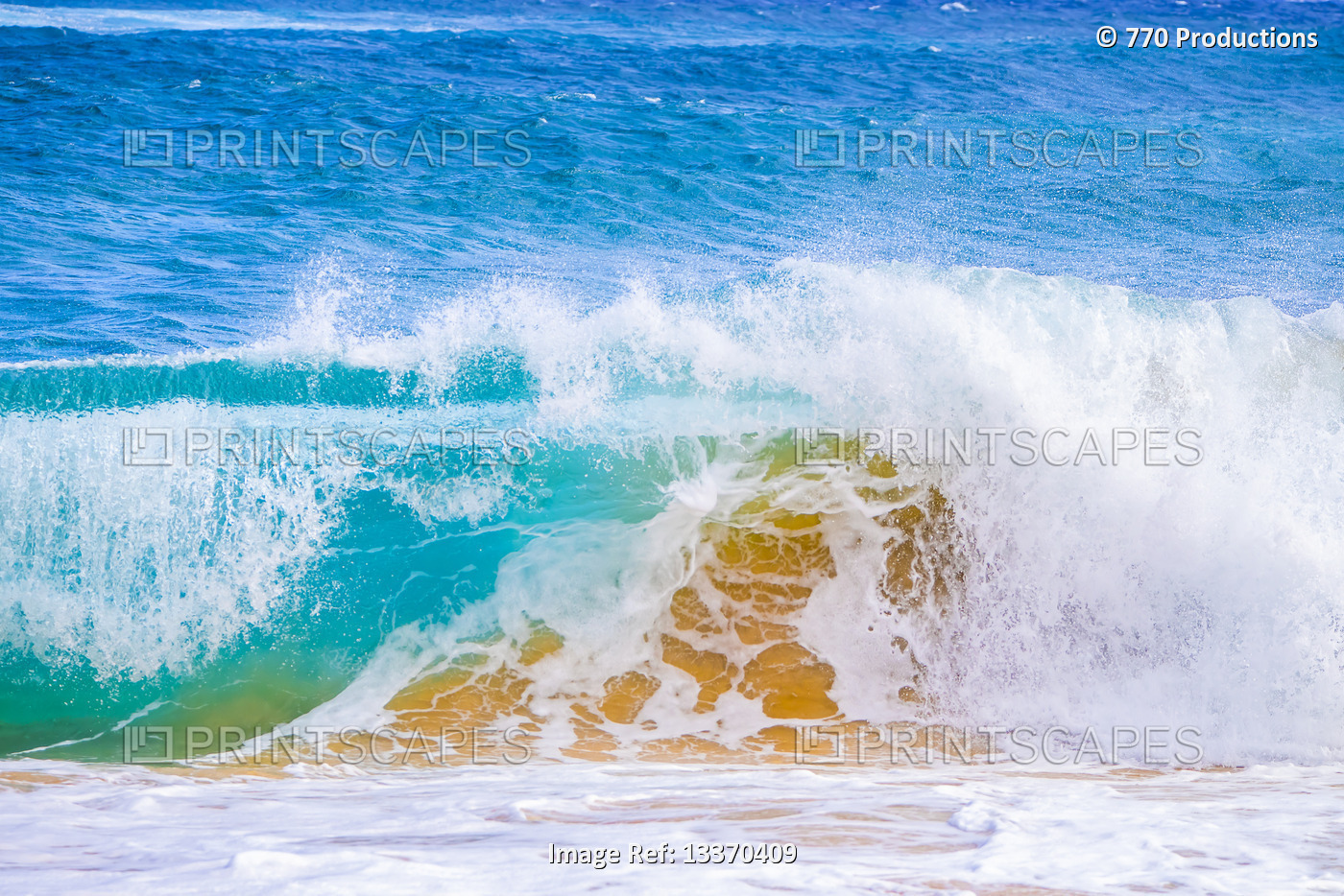 Splashing waves along the shore of sand; Oahu, Hawaii, United States of America