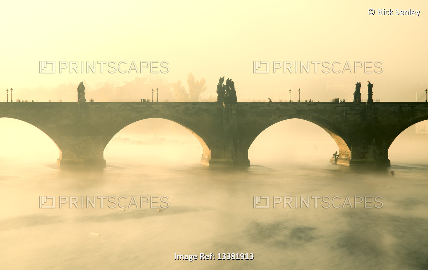 Early morning mist around Charles Bridge on the Vltava river; Prague, Czech ...