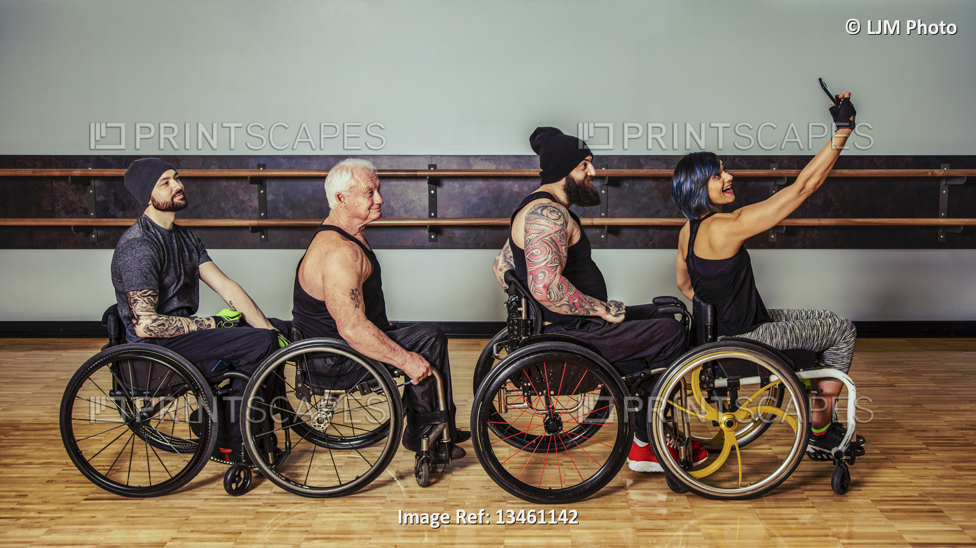 A group of paraplegic friends fooling around after a workout in fitness ...