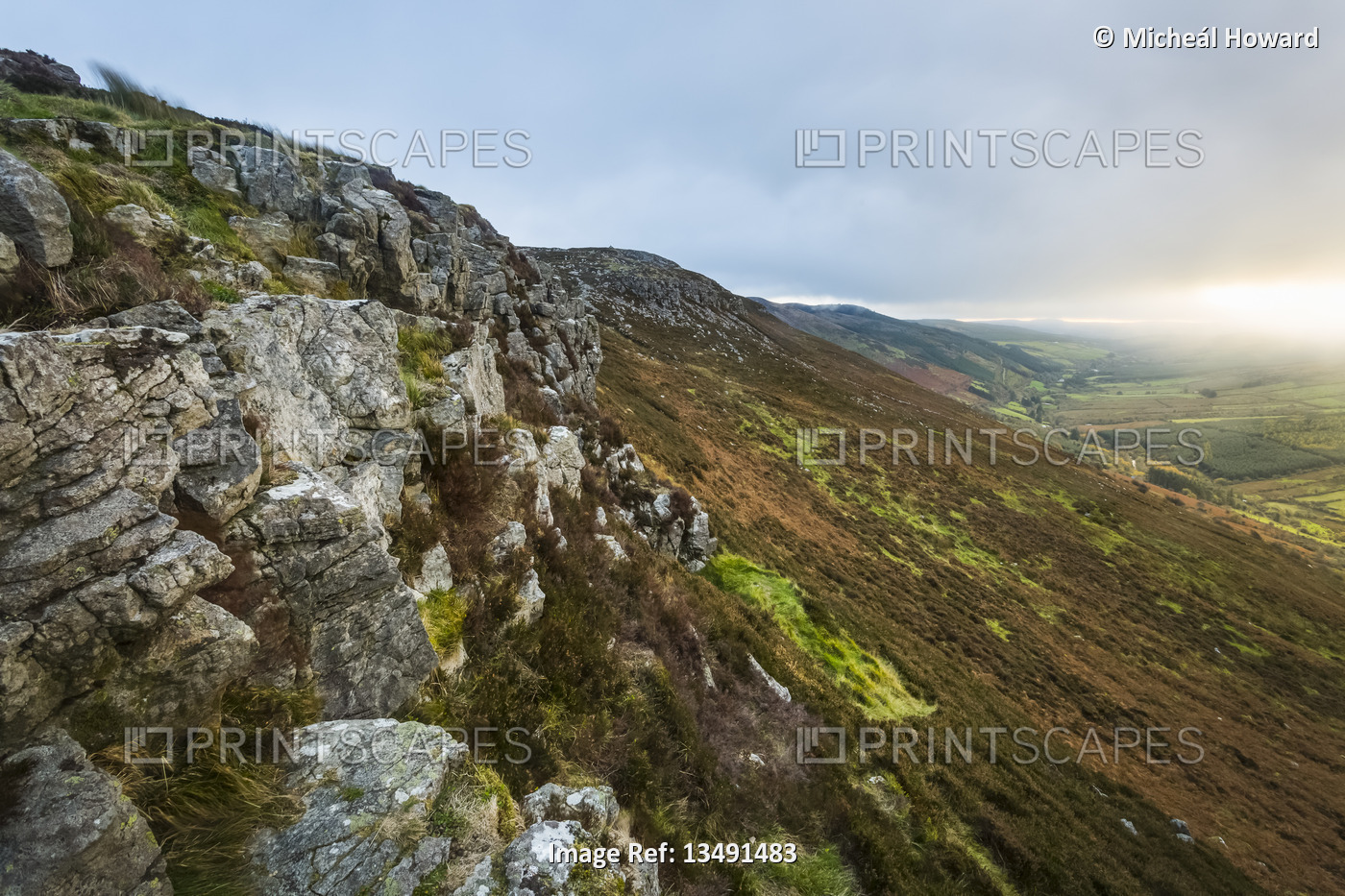 Small cliffs along the top of the Silvermine mountains on a cloudy day; County ...