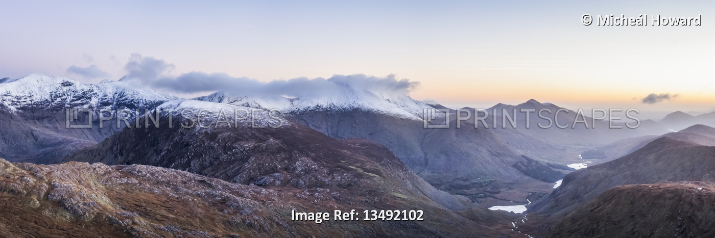 Panoramic view of the MacGillycuddy's Reeks in snow and the Black Valley at ...
