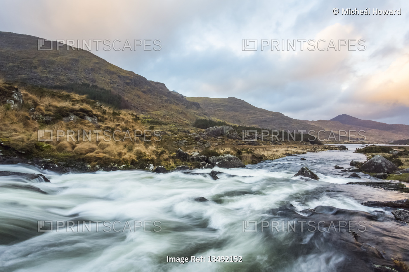 Cascades on a river in the Black Valley in Kerry with the MacGillycuddy's Reeks ...