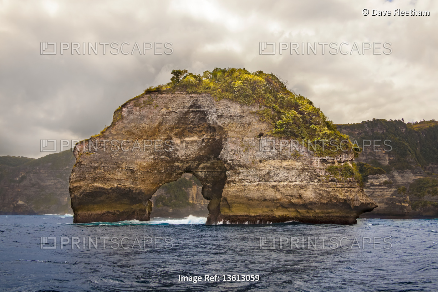 An offshore rock archway out from Broken beach and Manta bay; Nusa Penida, ...