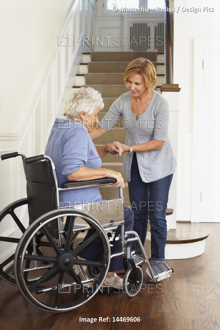 Senior Woman in Wheelchair Receiving Assistance