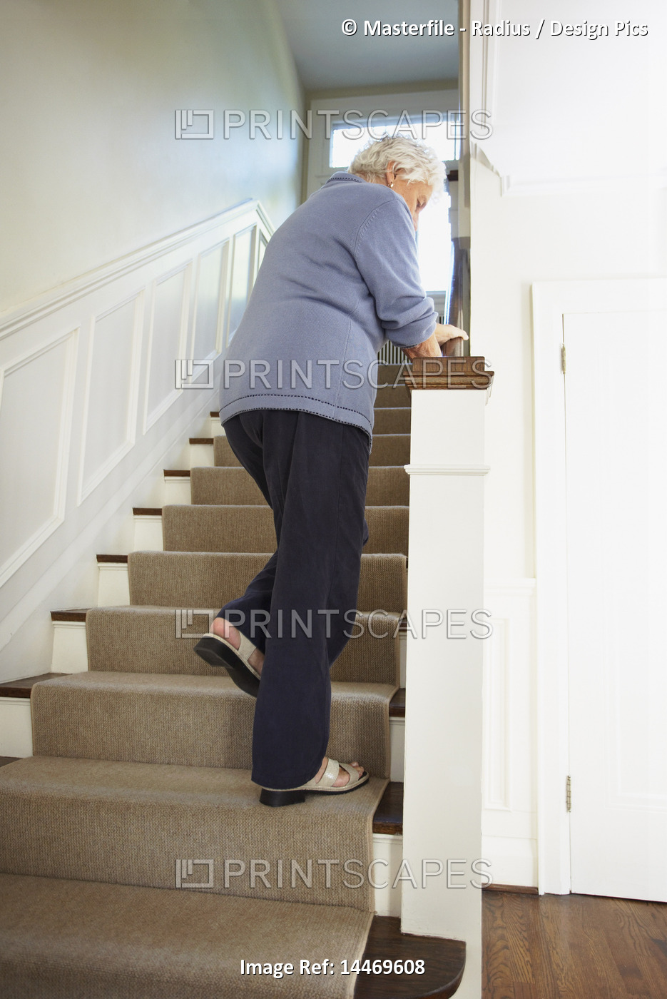 Senior Woman Trying to Walk up Stairs