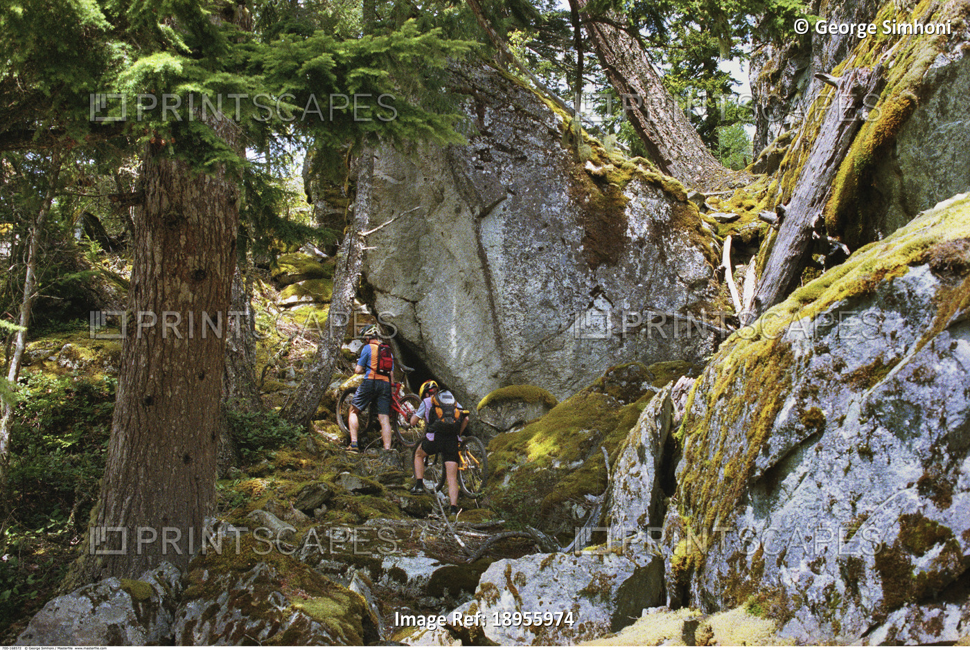 Couple Cycling through Rockies British Columbia, Canada