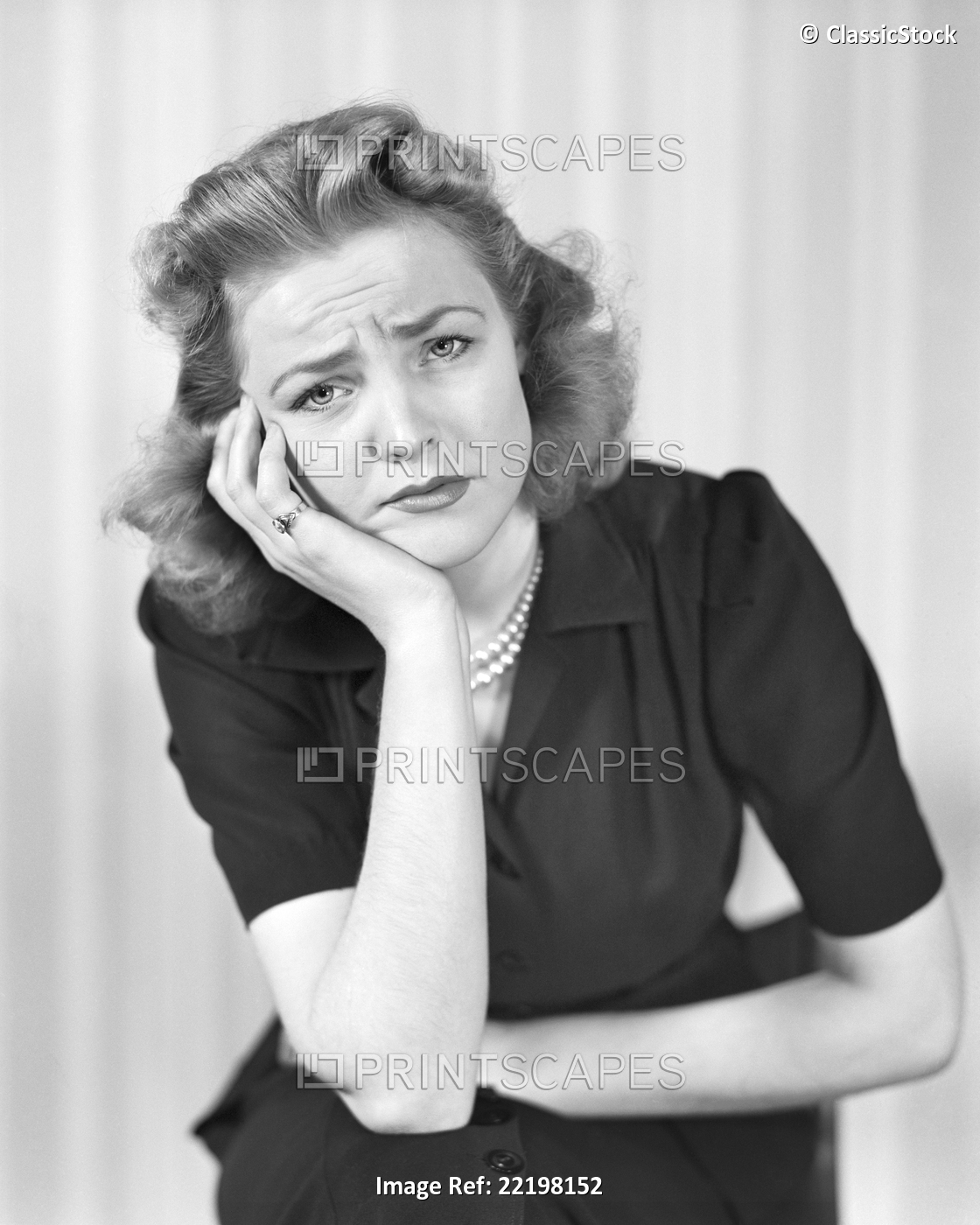 1940s WOMAN LOOKING AT CAMERA WITH A SAD DISGRUNTLED PAINED SICK FACIAL ...