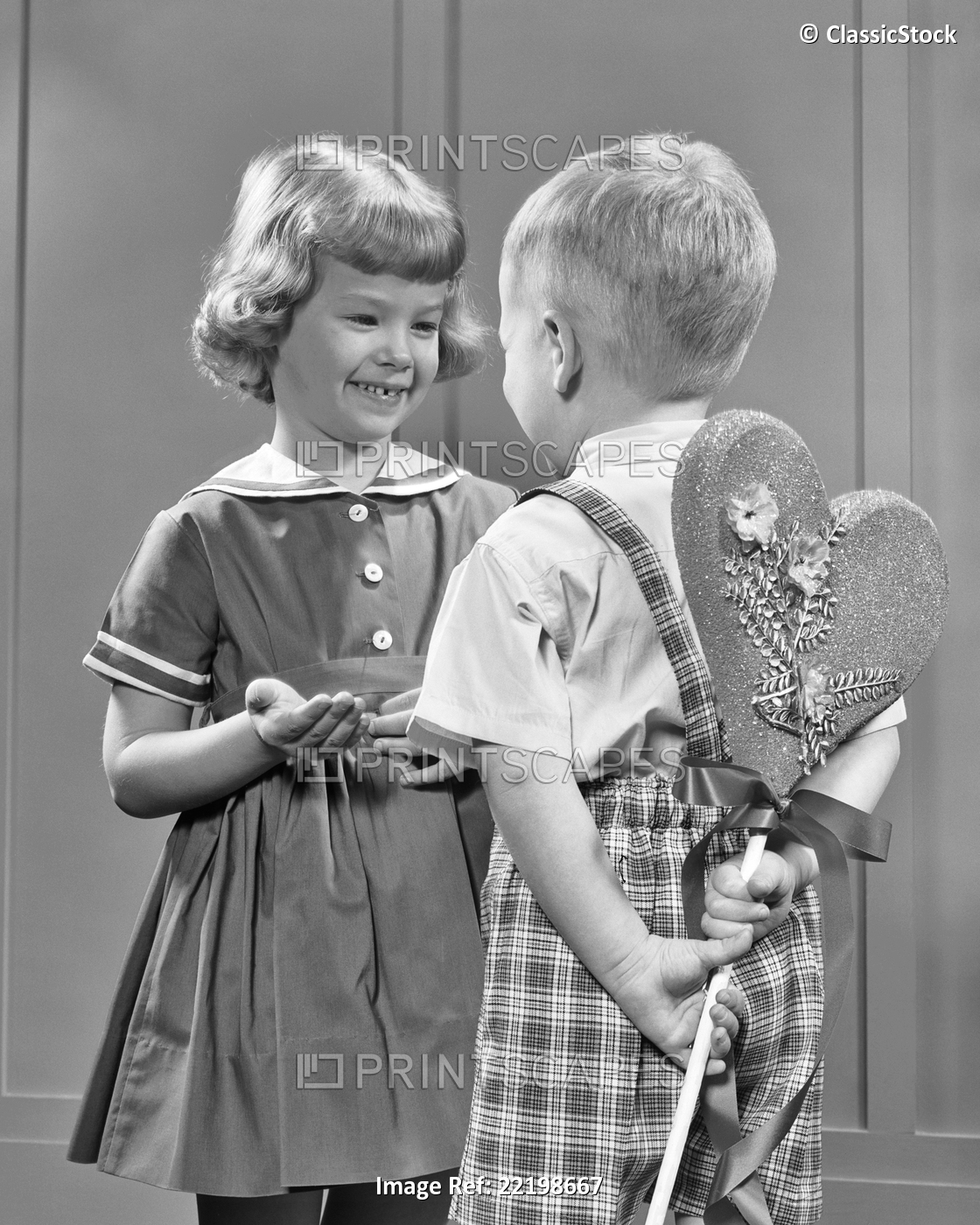 1950s 1960s BOY GIVING GIRL VALENTINE HEART ON STICK