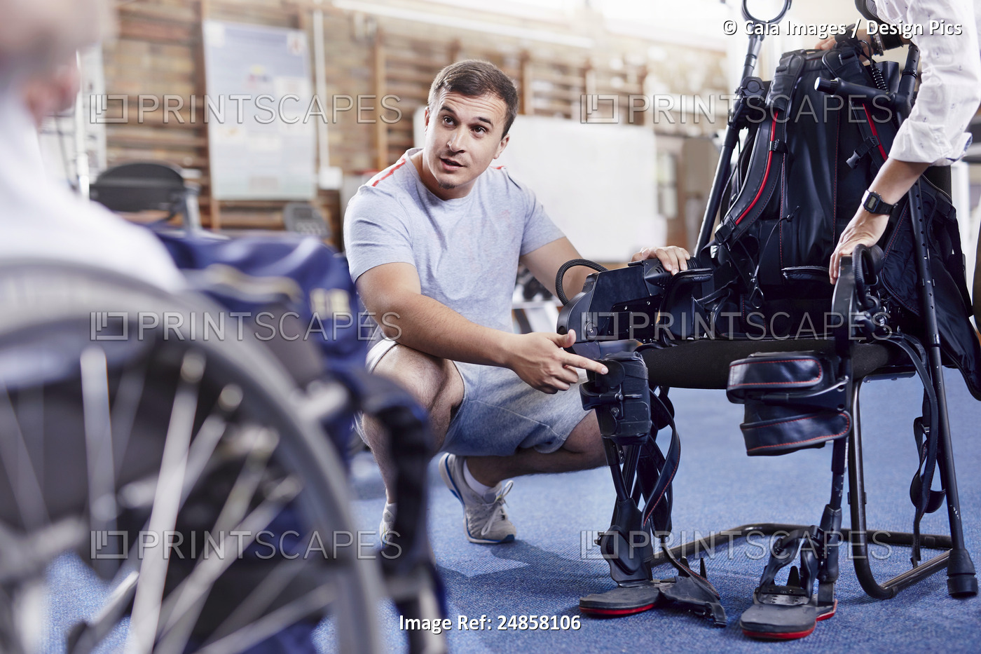 Physical therapist explaining equipment to man in wheelchair