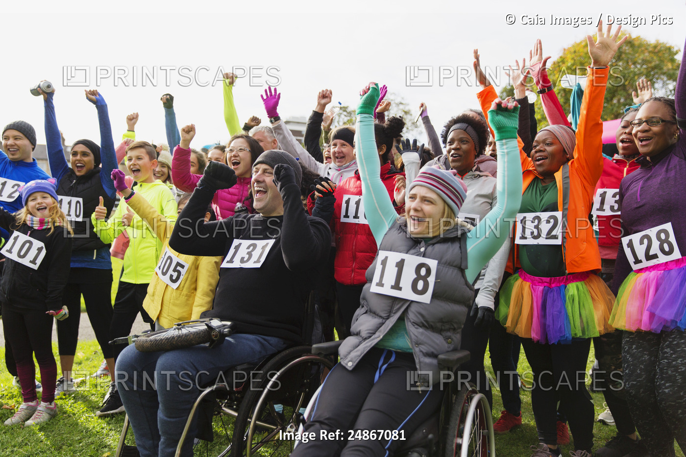 Enthusiastic crowd cheering at charity race in park