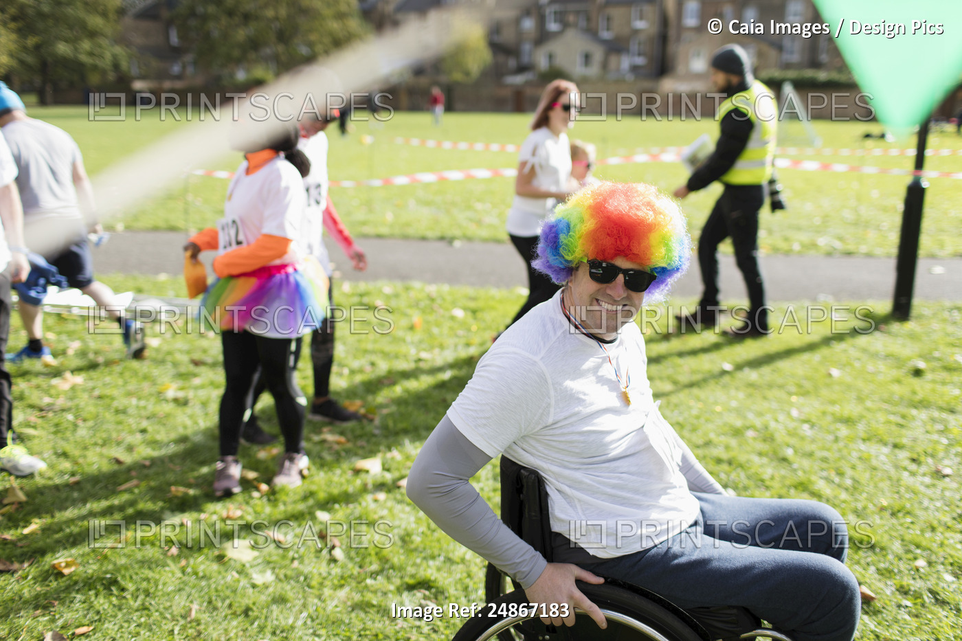 Portrait smiling, playful man in wheelchair wearing clown wig at charity race ...