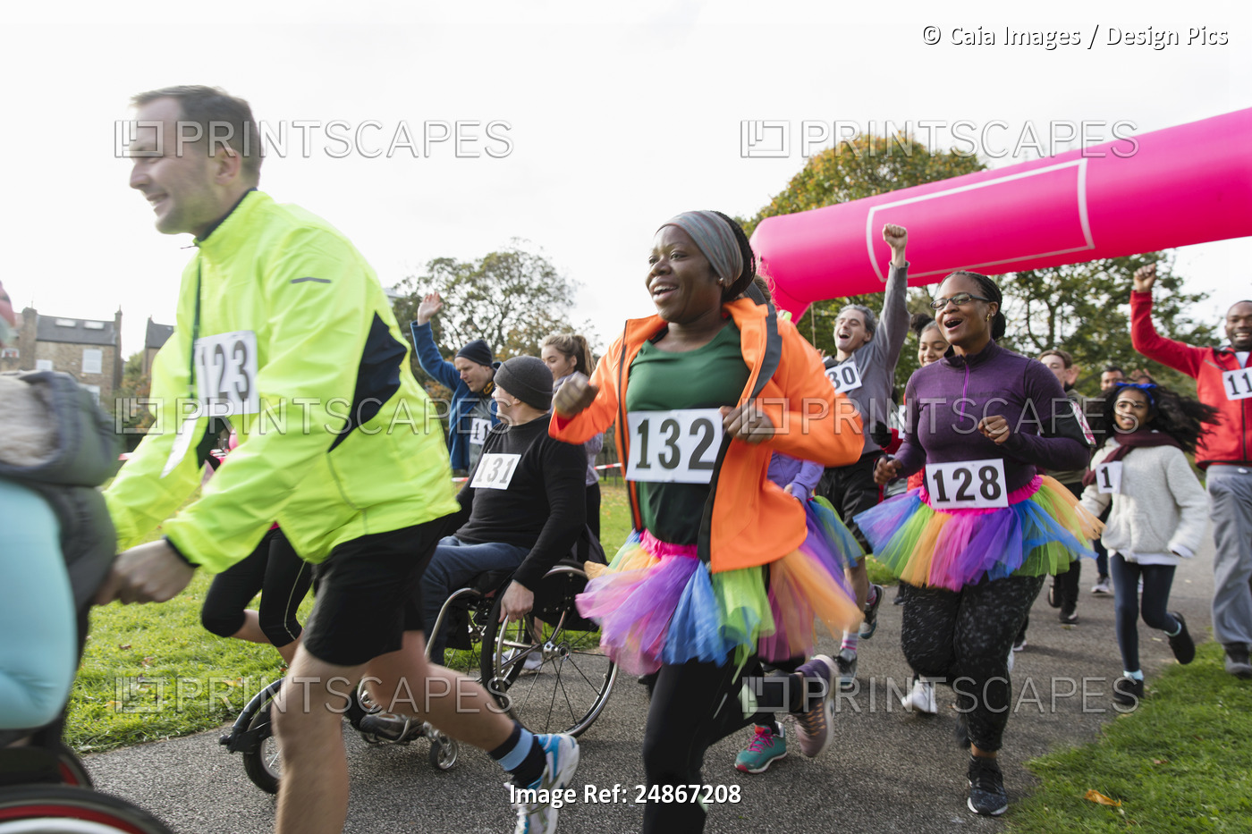 Enthusiastic runners running at charity run in park