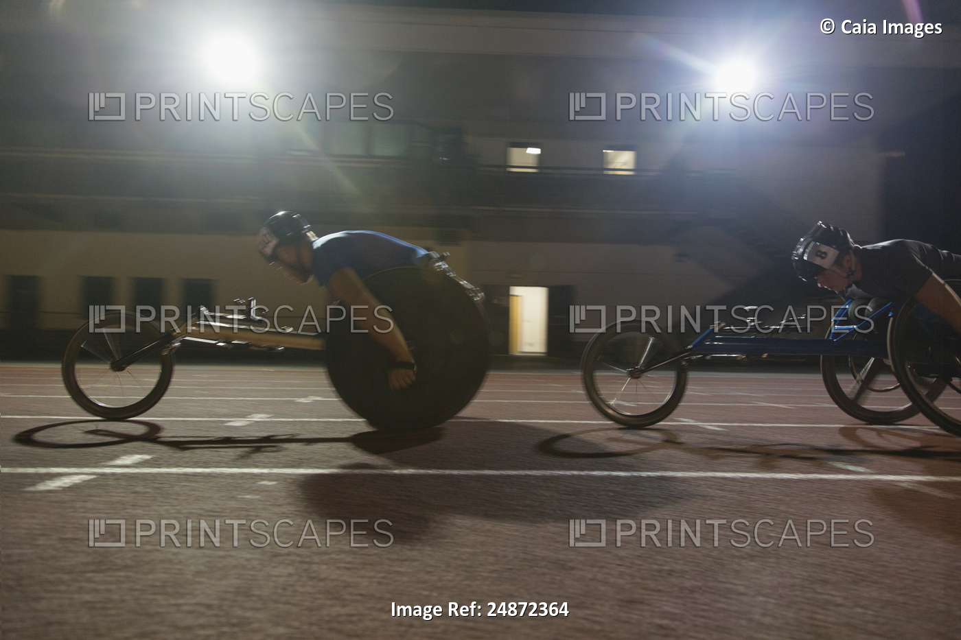 Paraplegic athlete speeding along sports track during wheelchair race