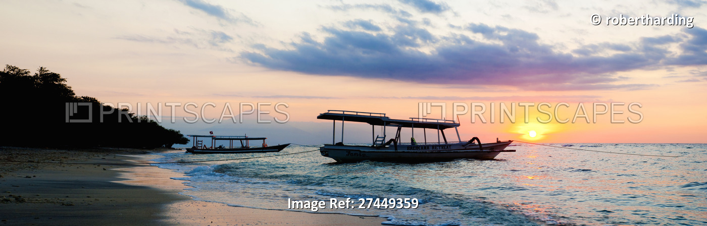 Mount Agung on Bali and fishing boats silhouetted against a sunset, Gili ...