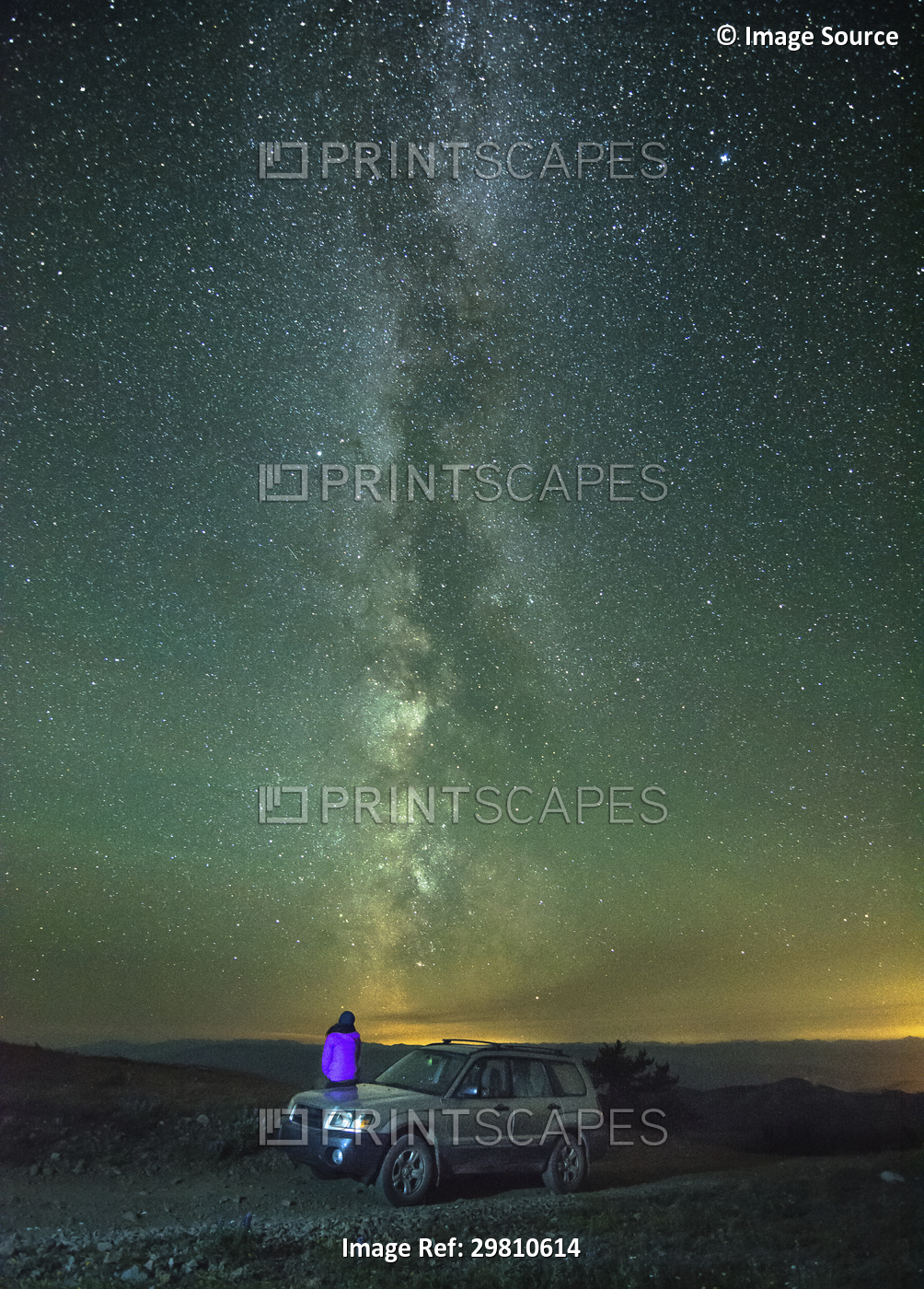 Person sitting on car, looking at view of milky way, rear view, Nickel Plate ...
