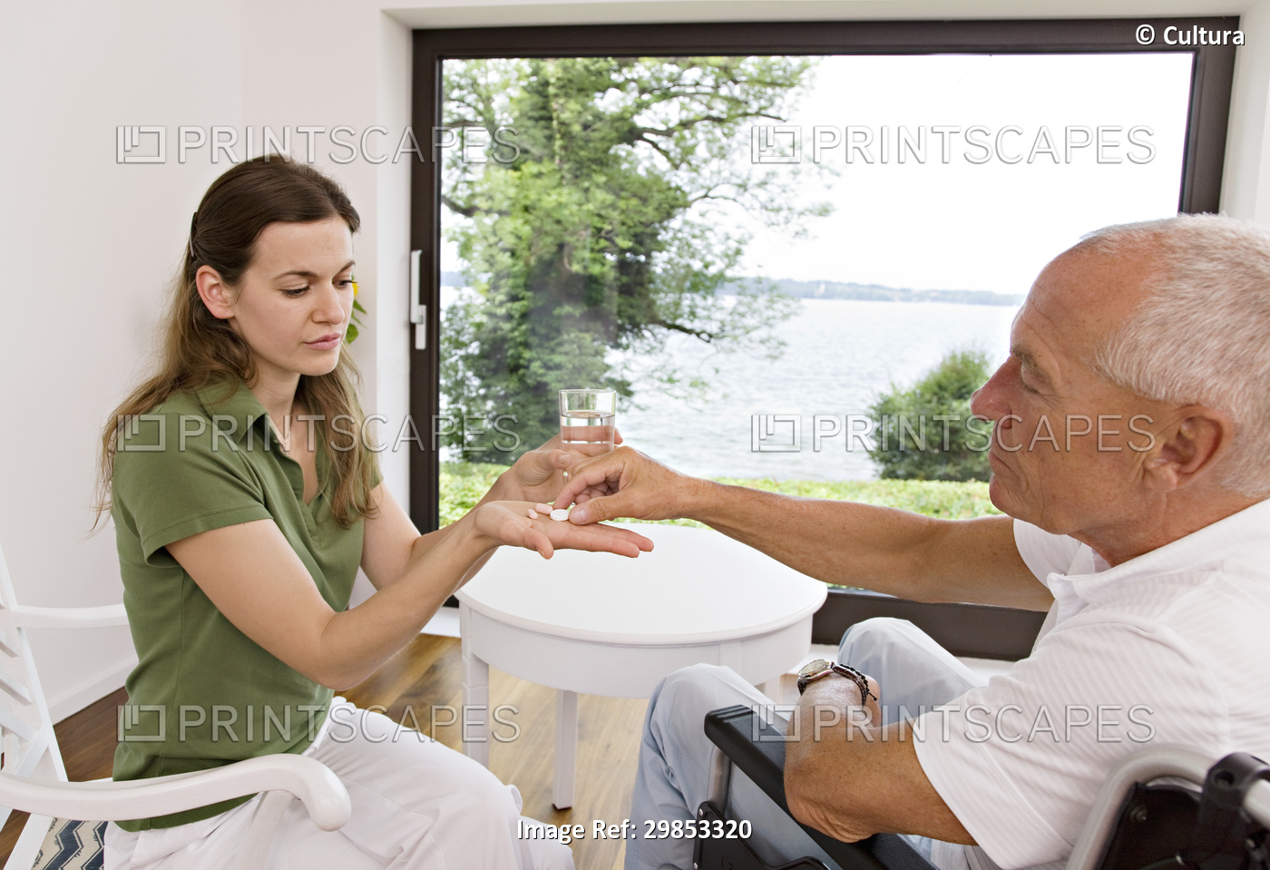 woman handing medicine to man