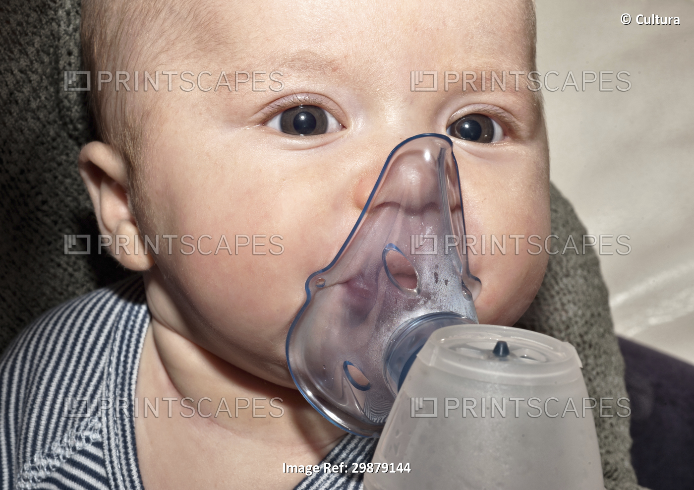 Newborn boy doing inhalation therapy