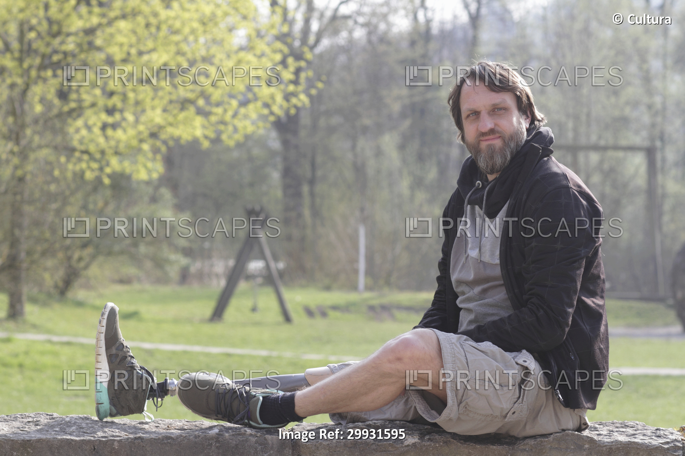 Portrait of man with prosthesis leg in park