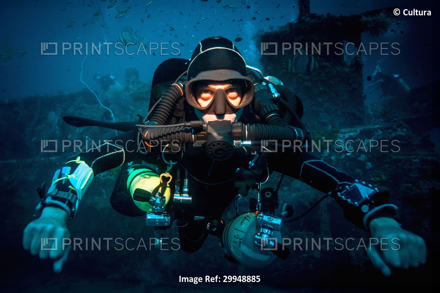 Underwater portrait of technical diver using a rebreather device to locate ...