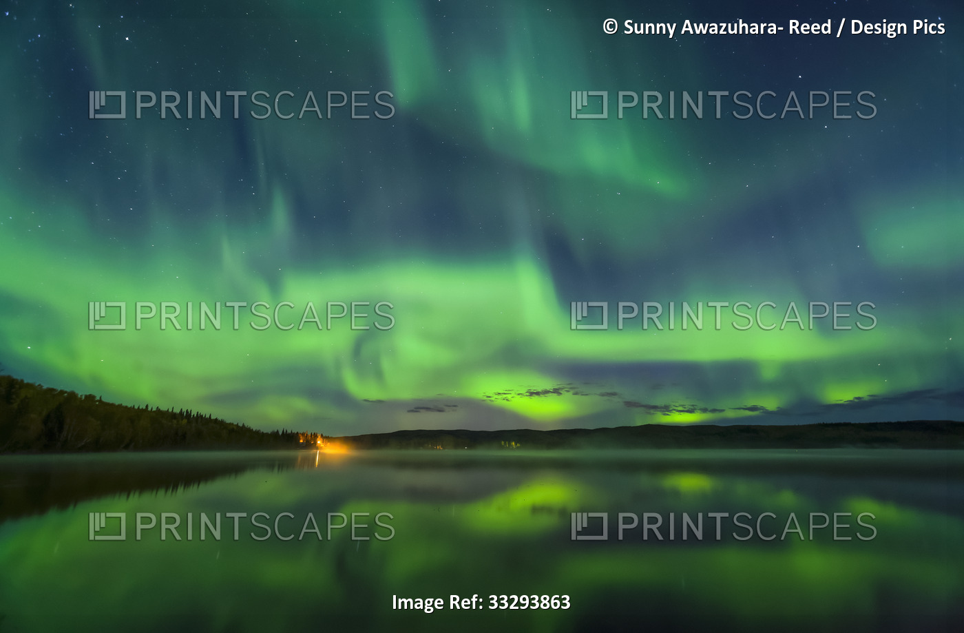 Bright green aurora dancing over Birch Lake with reflections, Interior Alaska ...