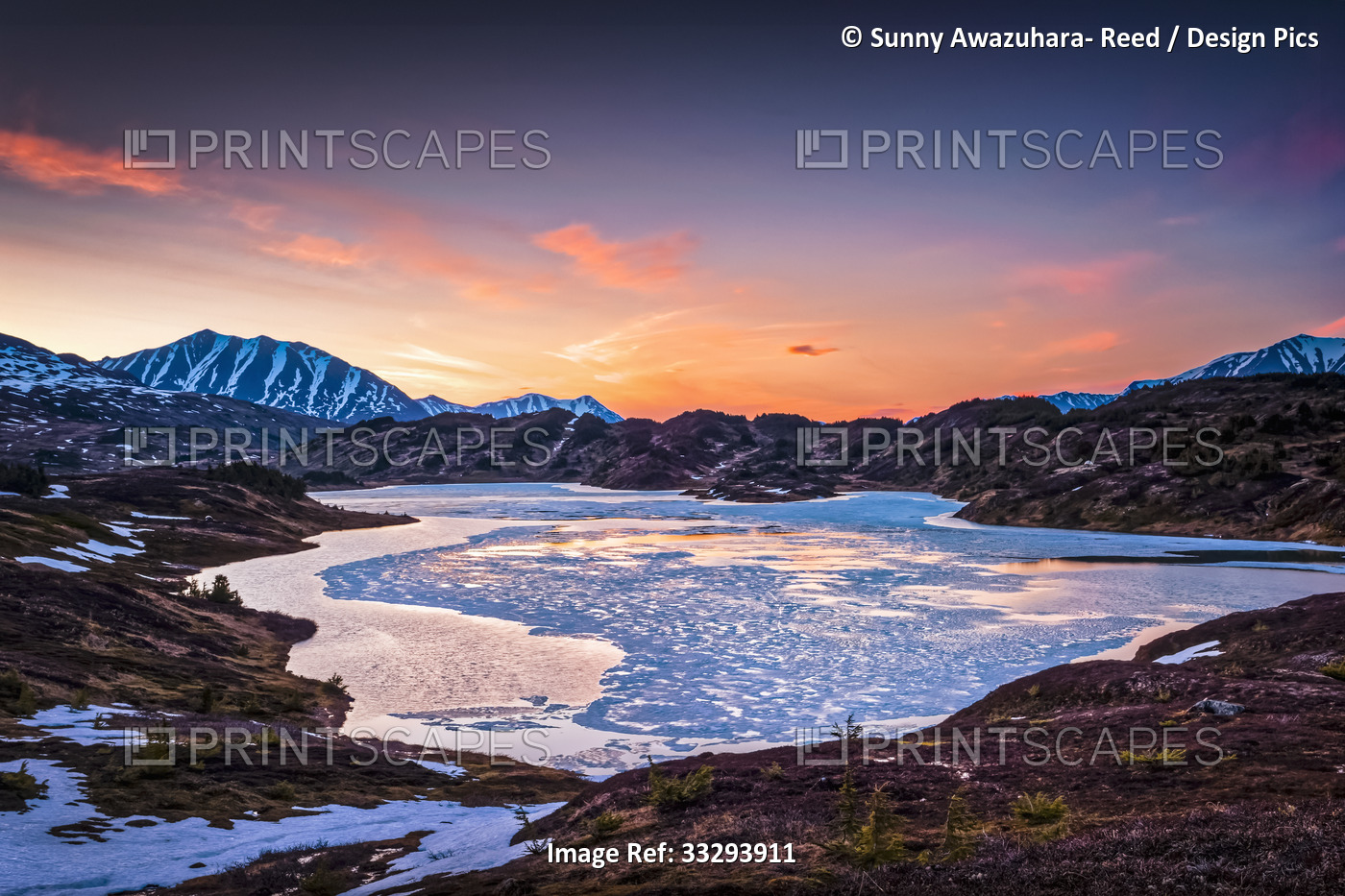 Half frozen Lost Lake at evening, Chugach Mountains in the background. Chugach ...