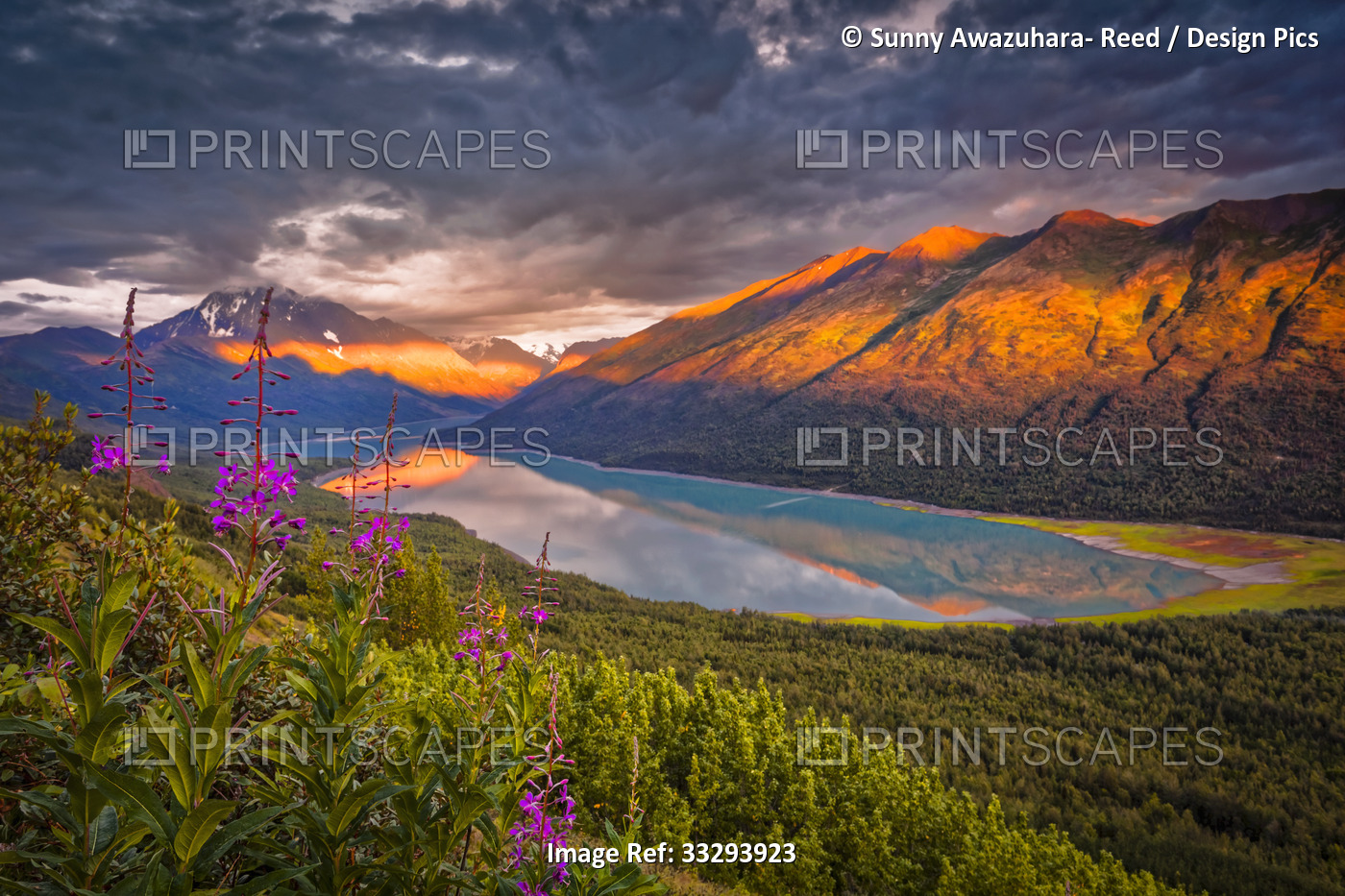 Aerial view of the sunset glow on Chugach Mountains, and reflection on Eklutna ...