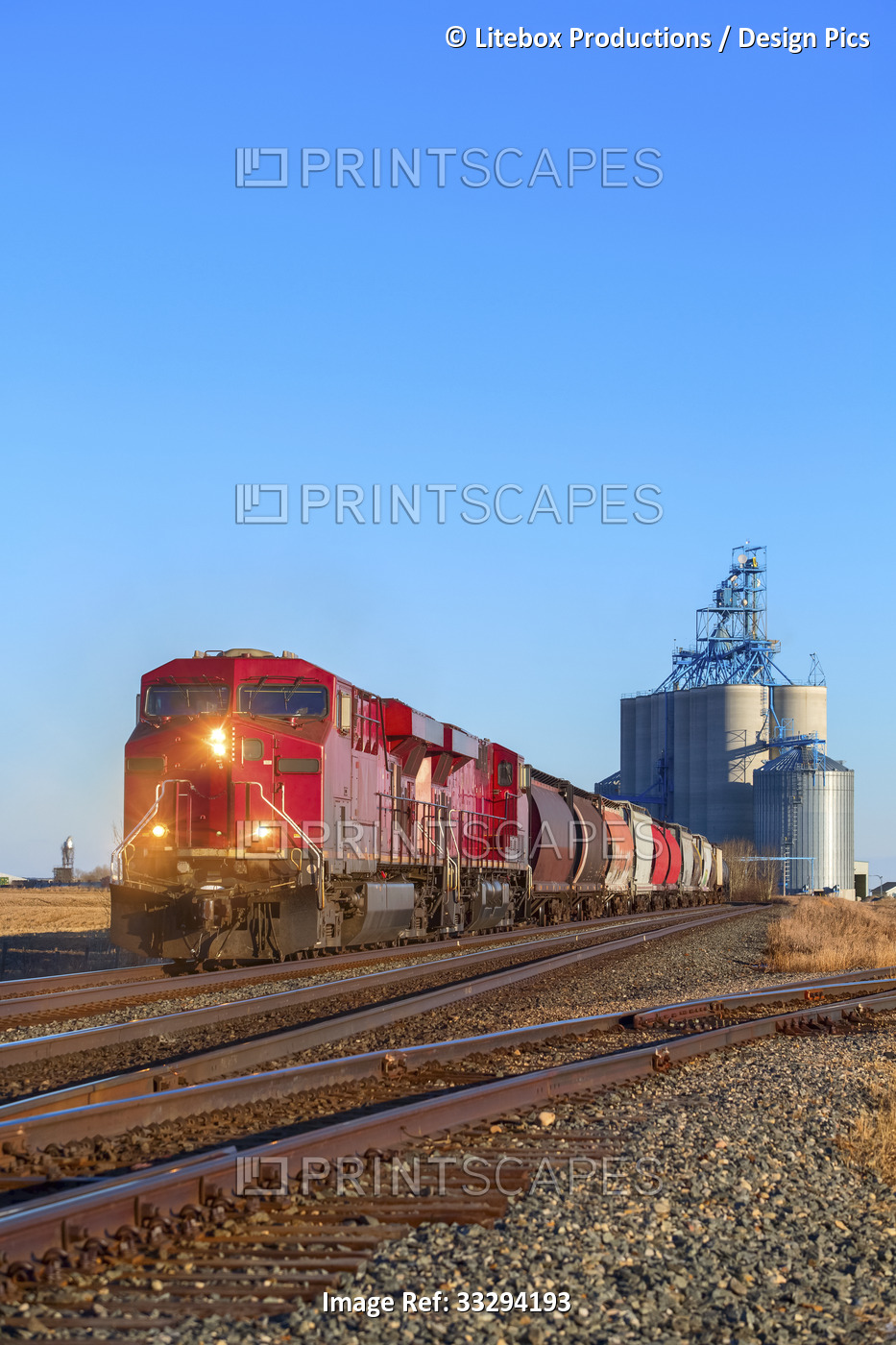 A freight train departing from a grain storage facility; Alberta, Canada