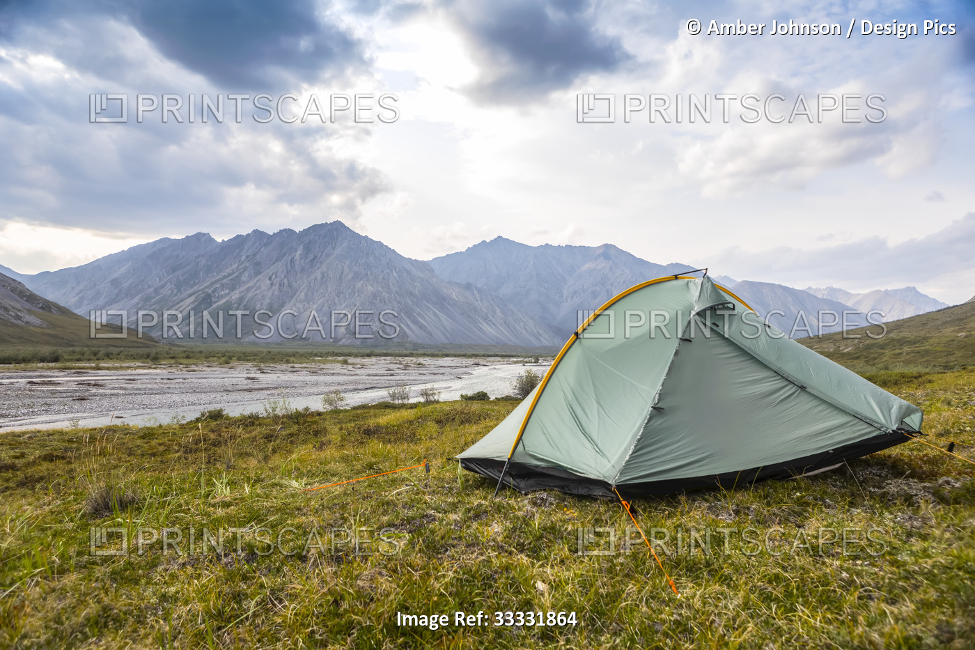 Green-grey backpacking tent set up on the tundra in summer, in the Brooks Range ...