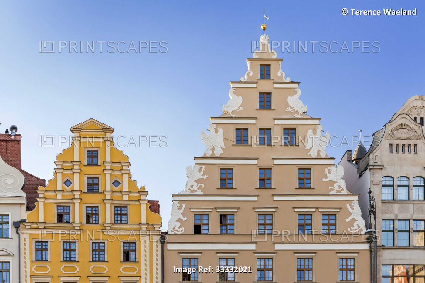 Decorative gables on buildings against a clear blue sky in Market Square; ...