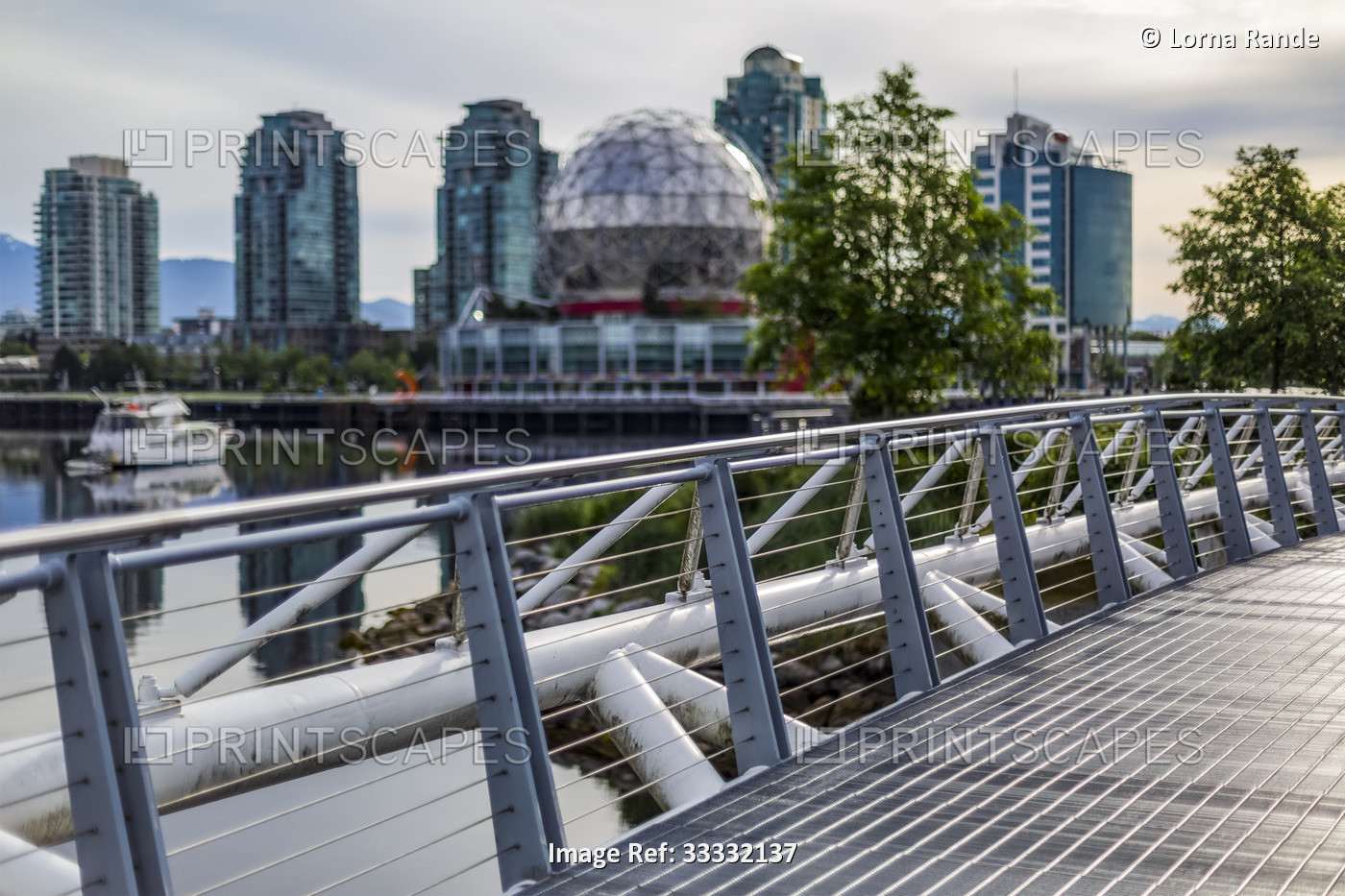 Science World and residential and commercial buildings at sunset along the ...