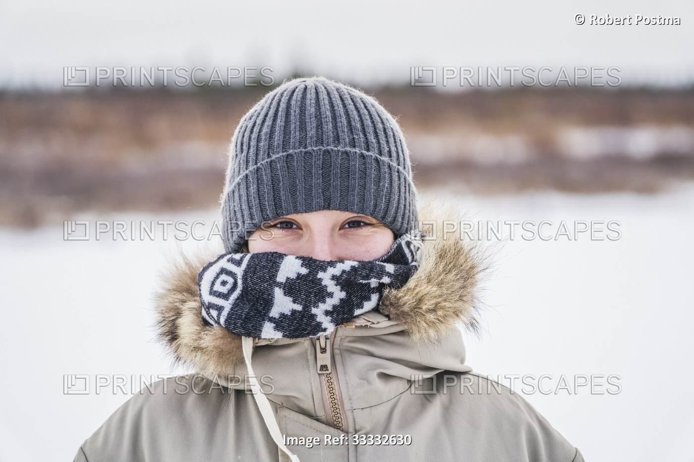 Close-up portrait of woman bundled up for the cold weather; Churchill, ...