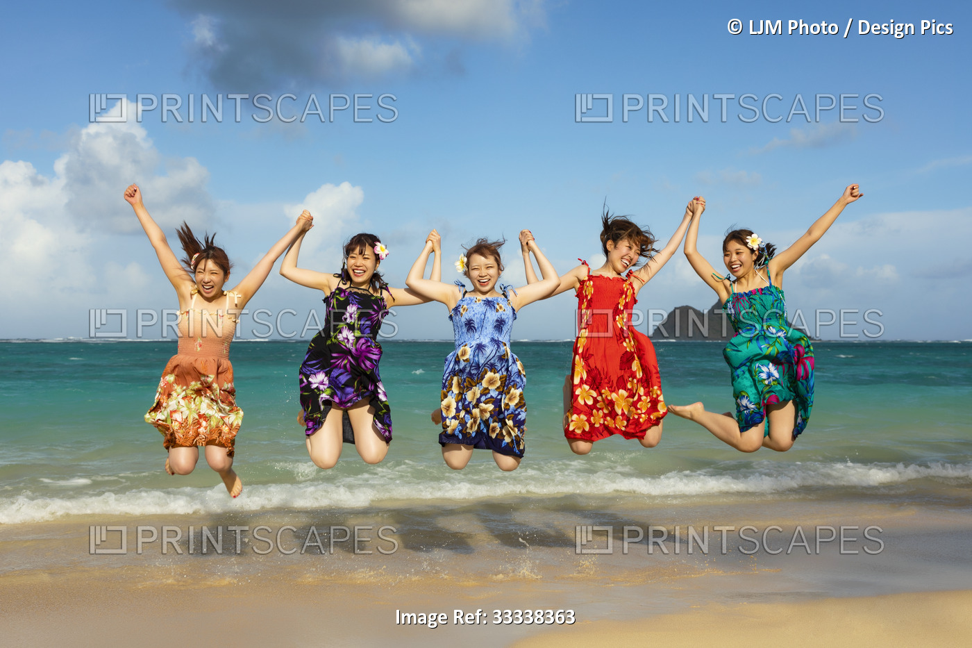 Japanese Students Jumping In The Air And Holding Hands While On Vacation At ...