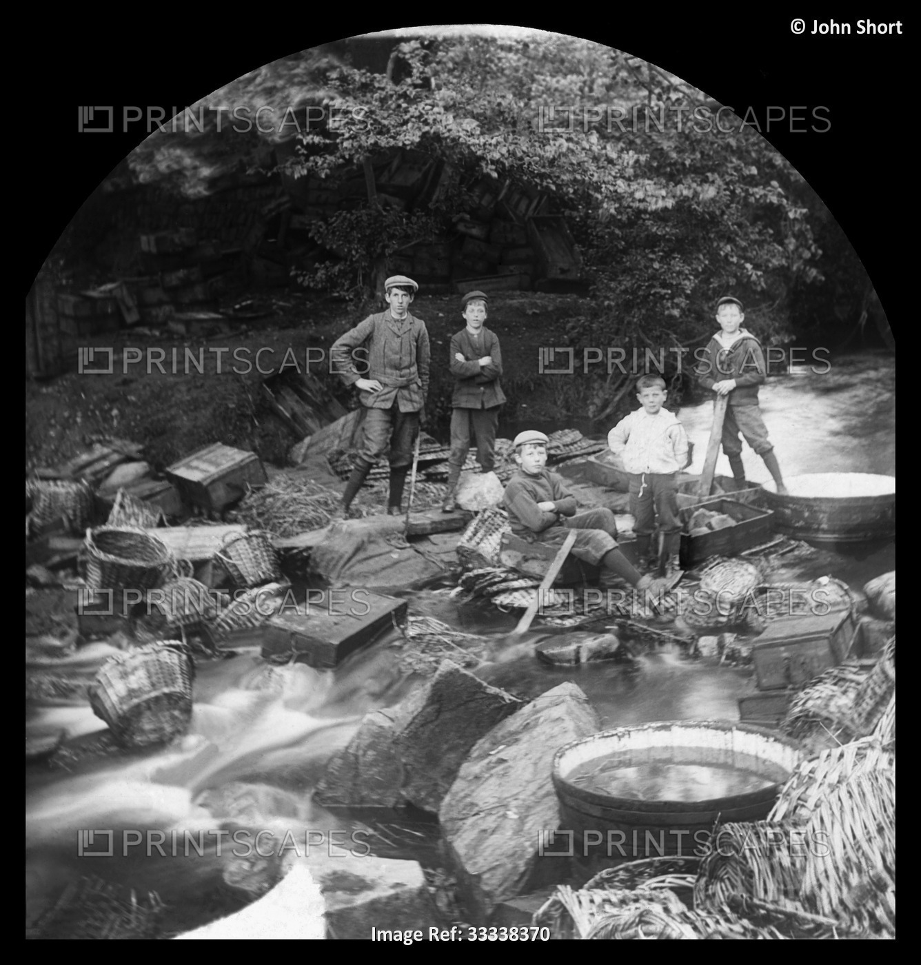 Children in a river with baskets and barrels