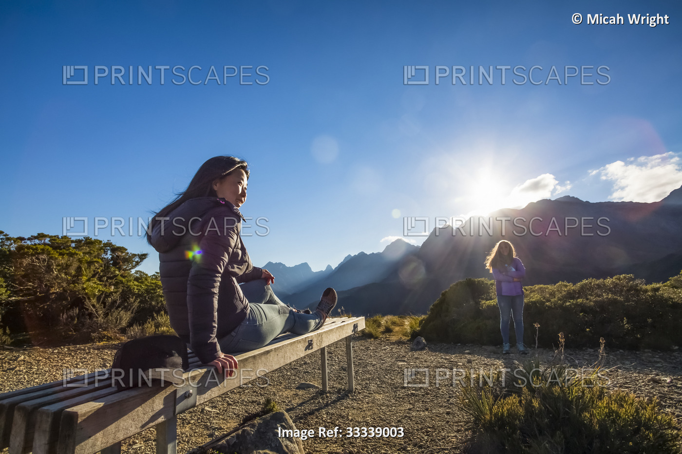 A woman relaxes at the summit during a hike through the Key Summit Track as ...