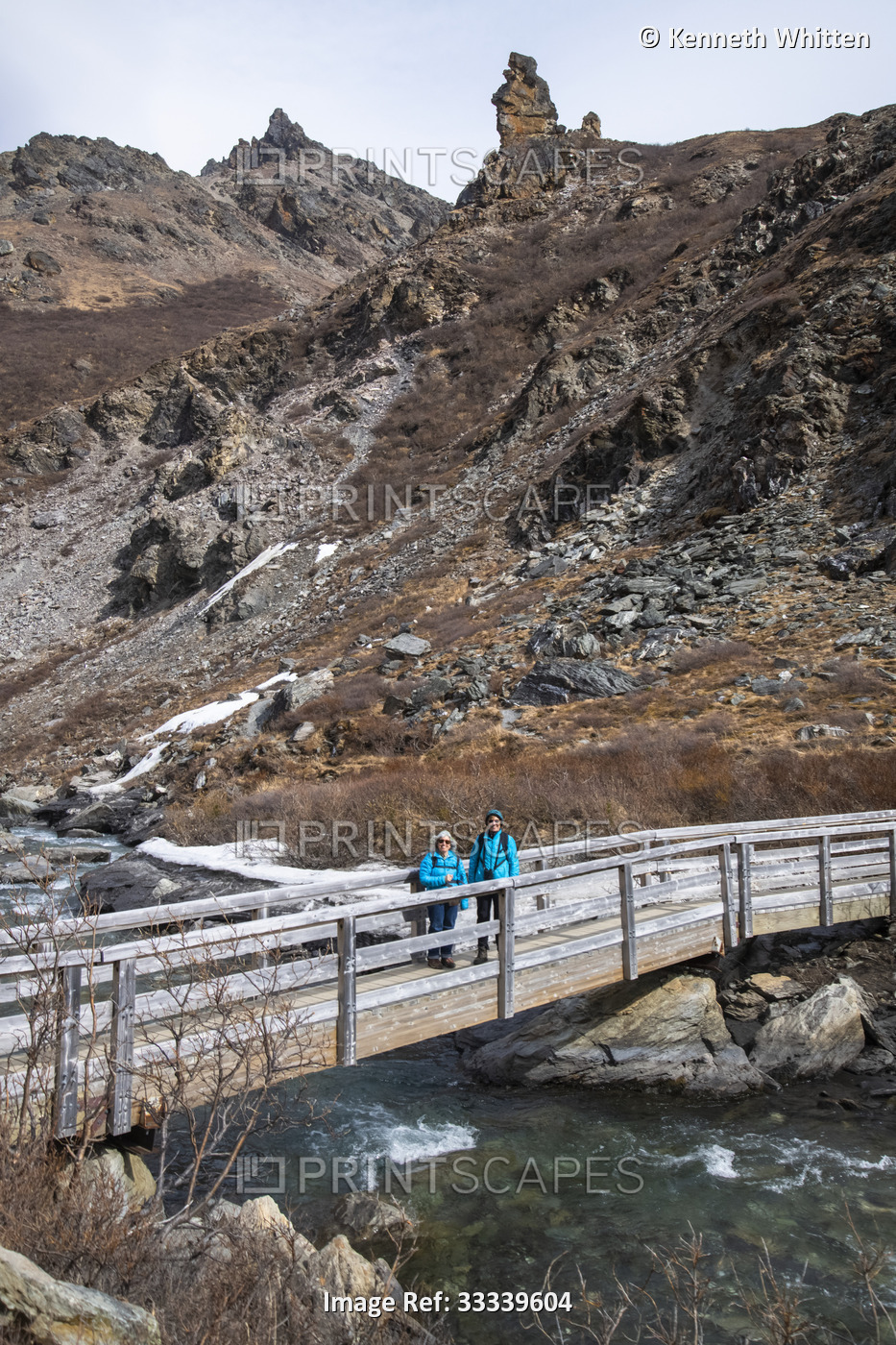 Two female hikers pause on bridge along the Savage River Loop trail during ...