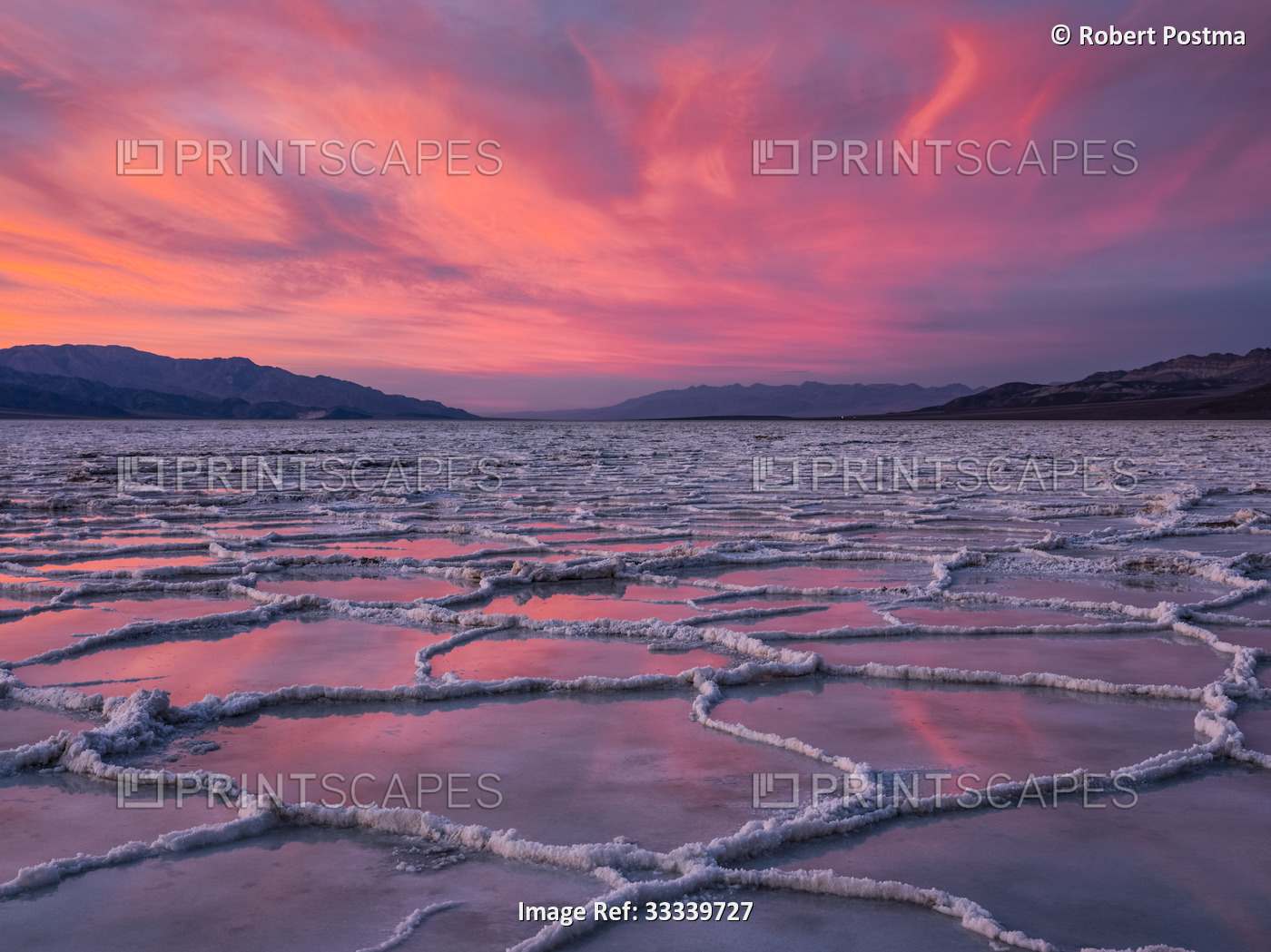 Sunset over the Badwater salt flats on Death Valley National Park; California, ...