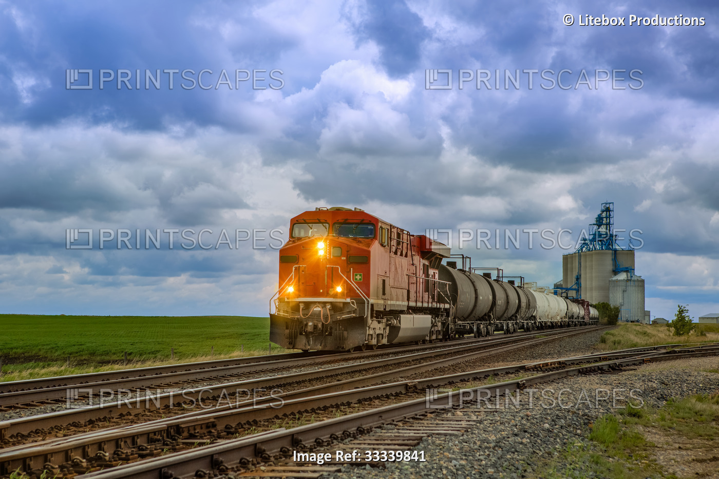 A freight train departing from a grain storage facility; Alberta, Canada